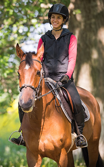 Horse riding near Les Peupliers campsite on the banks of the Canal du Midi in Colombiers